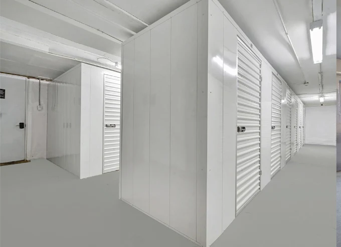 Row of white interior storage units in an apartment building